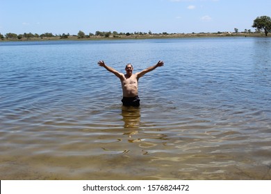 52 Years Old Man Jumping Into The Water In The Sailors Island In Southern Brazil