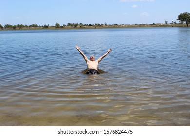 52 Years Old Man Jumping Into The Water In The Sailors Island In Southern Brazil