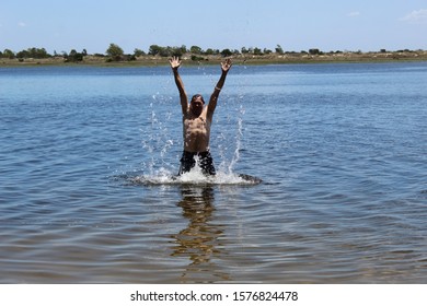 52 Years Old Man Jumping Into The Water In The Sailors Island In Southern Brazil