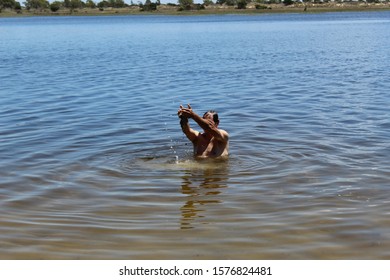 52 Years Old Man Jumping Into The Water In The Sailors Island In Southern Brazil