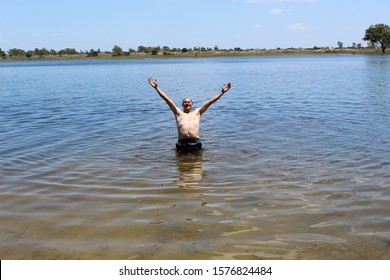 52 Years Old Man Jumping Into The Water In The Sailors Island In Southern Brazil