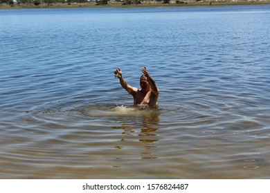 52 Years Old Man Jumping Into The Water In The Sailors Island In Southern Brazil