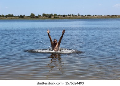 52 Years Old Man Jumping Into The Water In The Sailors Island In Southern Brazil