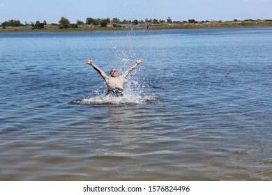 52 Years Old Man Jumping Into The Water In The Sailors Island In Southern Brazil