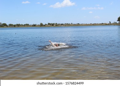 52 Years Old Man Jumping Into The Water In The Sailors Island In Southern Brazil