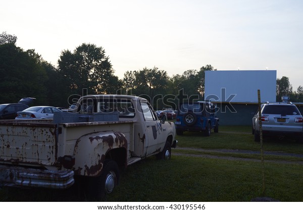 5/29/2016 Minetto NY- A drive in\
Movie theater. An old truck at a drive in movie theather at dusk.\
