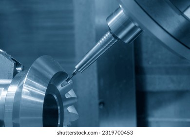 The 5-axis CNC milling machine  cutting the metal gear part. The hi-technology automotive part manufacturing process by CNC lathe. - Shutterstock ID 2319700453