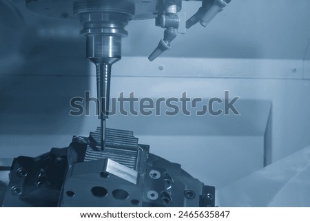 The 5-axis CNC milling machine  cutting the automotive part with solid ball end mill tool. The hi-technology automotive part manufacturing process by CNC lathe.