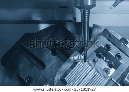 The 5-axis CNC milling machine  cutting the automotive part with solid ball end mill tool. The hi-technology automotive part manufacturing process by CNC lathe.