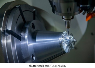 The  5-axis  machining center cutting the turbocharger parts with solid ball end mill tool. The hi-precision automotive manufacturing process by multi-axis CNC milling machine.