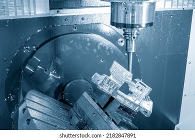 The 5-axis machining center table-tilt type cutting the aero space parts by indexable tool. The hi-technology 5-axis CNC milling machine manufacturing process. - Shutterstock ID 2182847891