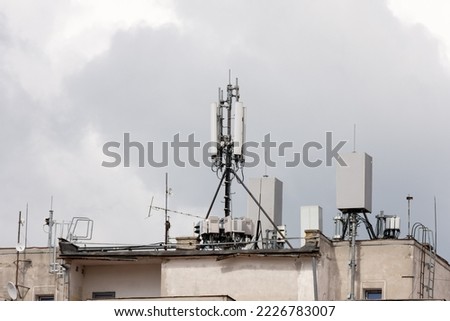 5G antenna on the roof of an old communist apartment building