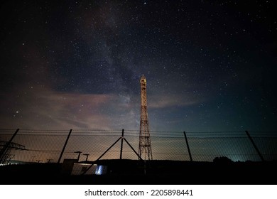 5G Cell Tower Mast Against The Background Of The Night Starry Sky