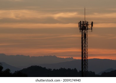 5G Cellular Tower Or Cell Phone Transmission Towers After The Sunset And The View Of Mountain