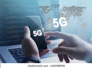 5G High speed internet network communication, man using mobile smartphone with 5G icons flow on virtual screen, worldwide connection. Internet of Things, IoT concept