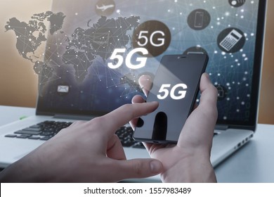 5G High speed internet network communication, man using mobile smartphone with 5G icons flow on virtual screen, worldwide connection