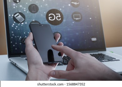 5G High speed internet network communication, man using mobile smartphone with 5G icons flow on virtual screen, worldwide connection