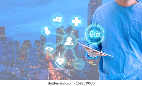 5G Internet Network With Surgeons Man Push 5G Button And Hold Tablet In Medical Uniform On White Background. 5G Internet Network With Healthcare Concept.