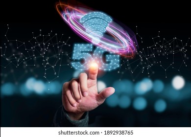 5G and internet of things or IOT concept, Hand touching virtual 5G signal. IOT is high technology which every device will connect and control by 5G high speed internet.
