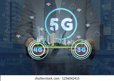 5G network interface and icon concept,Double exposure with businessman holding a tablet with cityscape