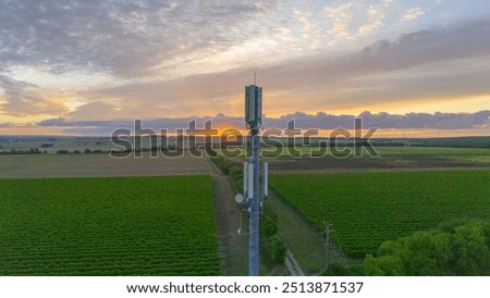 5G Tower Overlooking Fields During Sunrise