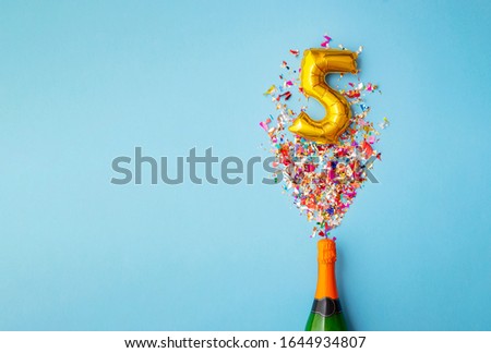 5th anniversary champagne bottle balloon pop