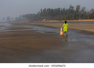 5th December, 2019, Tajpur Beach, West Bengal India: A Young Lady Cleaning Tajpur Beach, West Bengal, India. Fight Against Polution . Cean Beach Concept.