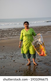 5th December, 2019, Tajpur Beach, West Bengal India: A Young Lady Cleaning Tajpur Beach, West Bengal, India. Fight Against Polution . Cean Beach Concept.