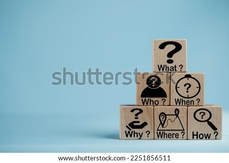 5W1H Root cause analysis.,Wooden cubes with the words and icons What, When, Why, Who, Where, and How on a blue background use for business concepts such as problem-solving and strategic planning.