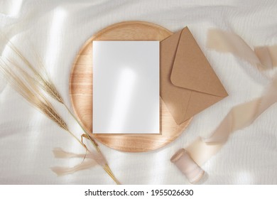 5x7 Invitation Card Mockup With Craft Envelope On Wooden Plate