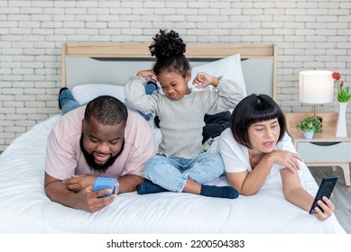 A 5-year-old African American Girl, Showing Up In A Bad Mood Because Her Parents Are Not Interested, And Using Mobile Phones All The Time, To Family And Social Media Concept.