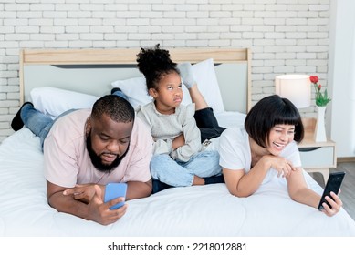 A 5-year-old Girl, Showing Up In A Bad Mood Because Her Parents Are Not Interested, And Using Mobile Phones All The Time, To Family And Social Media Concept.