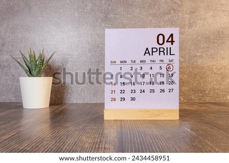 6 April on wooden grey cubes. Calendar cube date 06 April. Concept of date. Copy space for text or event. Educational cubes. Wood blocks in box with date, day and month. Selective focus