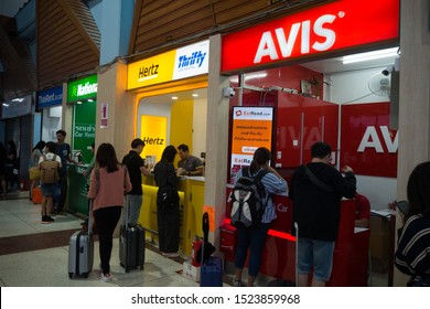 6 OCT 2019 , Rent a car at 
Chiang Rai AIRPORT, Thailand. Stands of car rental companies. Passengers stand in queue for vehicle.