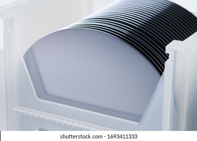 6" silicon wafers in container - Shutterstock ID 1693411333