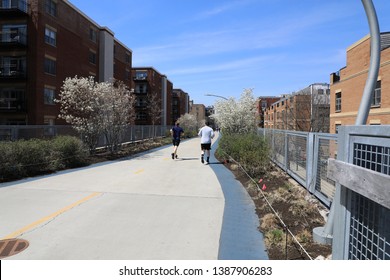 The 606 Is An Elevated Park In Chicago, Also Known As The Bloomingdale Trail.  Used By Pedestrians, Skaters, And People Riding Bicycles.