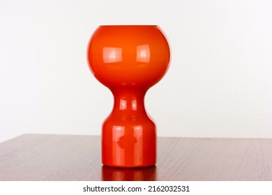 A 60s Modern Orange Bedside Lamp With Glass Spaceage Vintage Midcentury Design Front Side View Isolated On White Background With Warm Orange Light In The Studio Living Room Creative HQ 60s Furniture