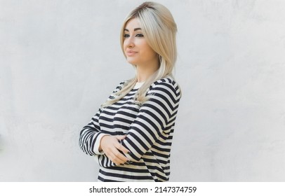 60s-70s Look. Woman Blonde Hair Vintage Makeup Wear Striped Jumper, Fashionable Concept