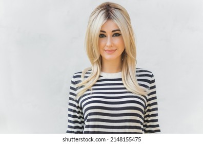 60s-70s Look. Woman Blonde Hair Vintage Makeup Wear Striped Jumper, Fashionable Concept