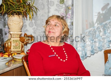 Similar – Image, Stock Photo Short-haired woman warms her hands with her breath in the autumn in the park
