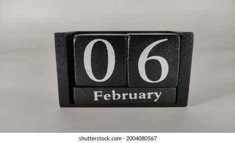 6th February Written On Black Wood Block.