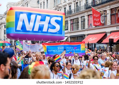 6th July 2019 - London, UK - The NHS Staff From Guys And St Thomas’ Hospital Walking Down Regent Street As Part Of The 2019 London Pride Festival With Bright Rainbow Inflatable And NHS Logo