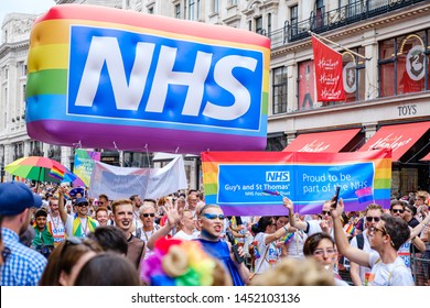 6th July 2019 - London, UK - The NHS Staff From Guys And St Thomas’ Hospital Walking Down Regent Street As Part Of The 2019 London Pride Festival With Bright Rainbow Inflatable And NHS Logo