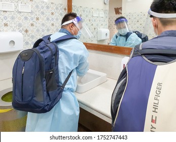 6th June 2020- Netaji Subhas Chandra Bose International Airport, Calcutta, India-travellers Wash Hands In Basin While In Full Personal Protective Gear.