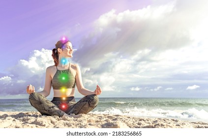 7 chakras. Happy woman meditates on the seashore. Girl in lotus position - Shutterstock ID 2183256865