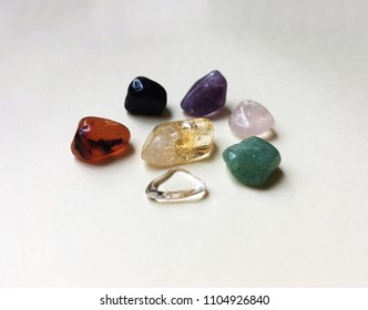 The 7 Lucky Stones:crystal-peace; agate-friendship;onyx-protection;pink quartz-love;green quartz-health;citrine-prosperity;amethyst-spirituality. - Powered by Shutterstock