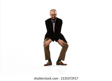 70s, 80s Dance Style. Studio Shot Of Emotional Young Man In Retro Style Clothes, Vintage Outfit Dancing Lindy Hop Dance Isolated On White Background. Concept Of Culture, Art, Music, Fashion Style, Ad