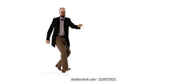 70s, 80s Dance Style. Studio Shot Of Emotional Young Man In Retro Style Clothes, Vintage Outfit Dancing Lindy Hop Dance Isolated On White Background. Concept Of Culture, Art, Music, Fashion Style, Ad