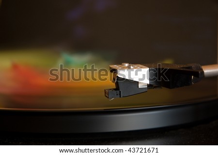 70's model turntable playing some colourful music