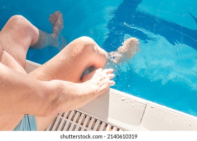 A 70-year-old pensioner is resting, swimming, recovering in the pool with clear and blue water in the hotel.